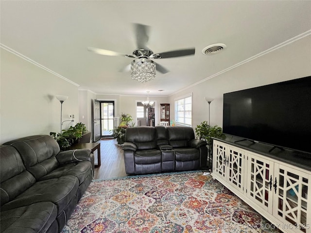 205 NE 1st St, Kingston, OK 73439 - living area with ceiling fan, a chandelier, crown molding, and wood finished floors