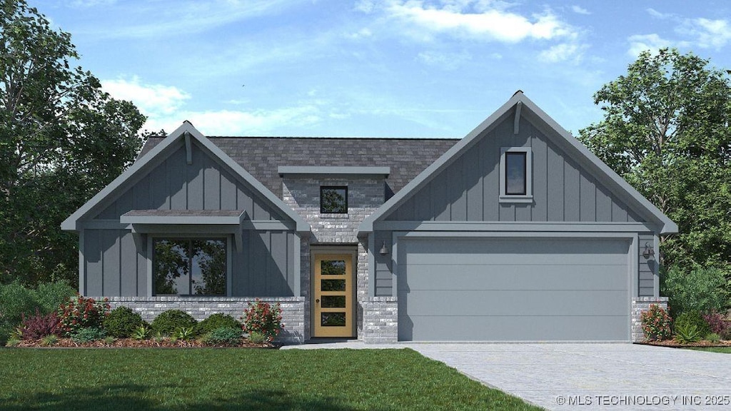 view of front of house with board and batten siding, concrete driveway, a front yard, an attached garage, and brick siding