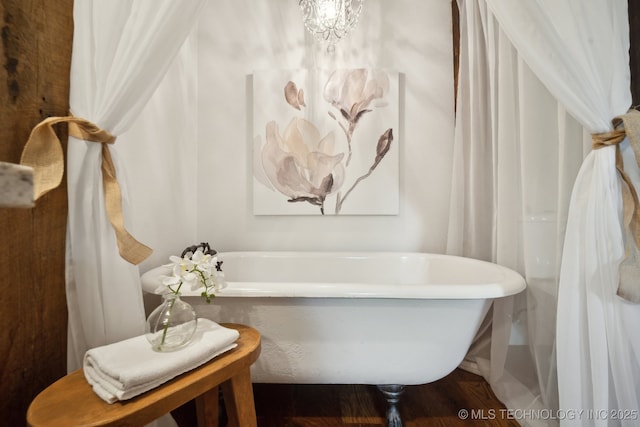 full bathroom featuring a freestanding bath