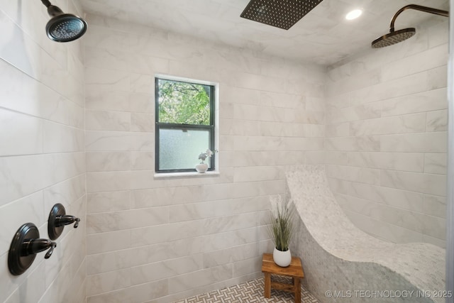 full bathroom with tiled shower