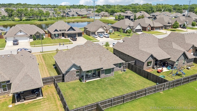 aerial perspective of suburban area with a large body of water