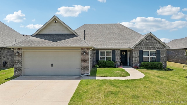 traditional-style house with a shingled roof, a garage, a front yard, brick siding, and driveway