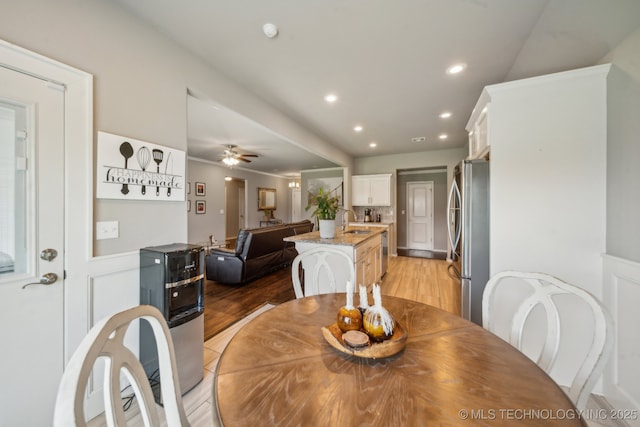 dining space with recessed lighting, light wood-style floors, and a ceiling fan