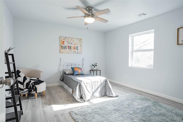 2017 N Quaker Ave, Tulsa, OK 74106 - bedroom featuring wood finished floors, baseboards, and a ceiling fan