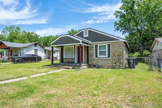 2017 N Quaker Ave, Tulsa, OK 74106 - view of front facade with covered porch and stone siding