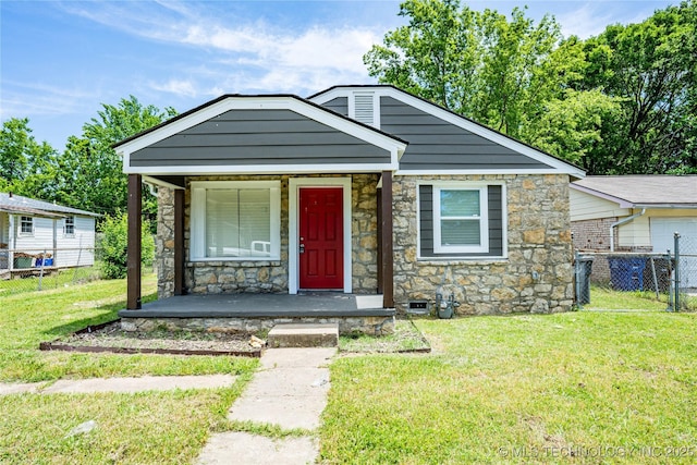 2017 N Quaker Ave, Tulsa, OK 74106 - view of front of house with stone siding and covered porch