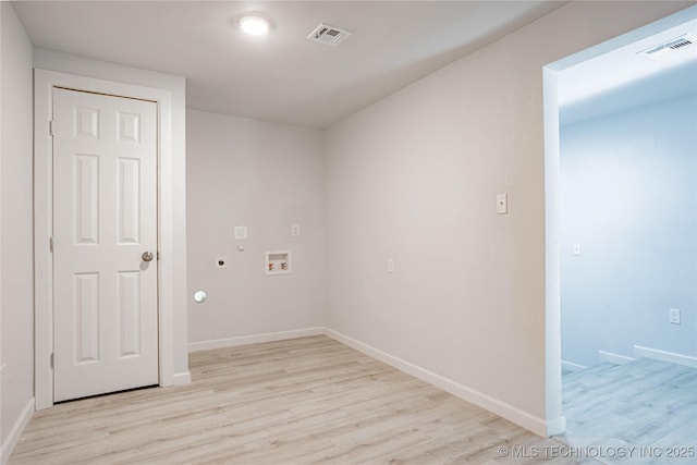 2017 N Quaker Ave, Tulsa, OK 74106 - laundry area with light wood finished floors, hookup for an electric dryer, hookup for a washing machine, baseboards, and gas dryer hookup