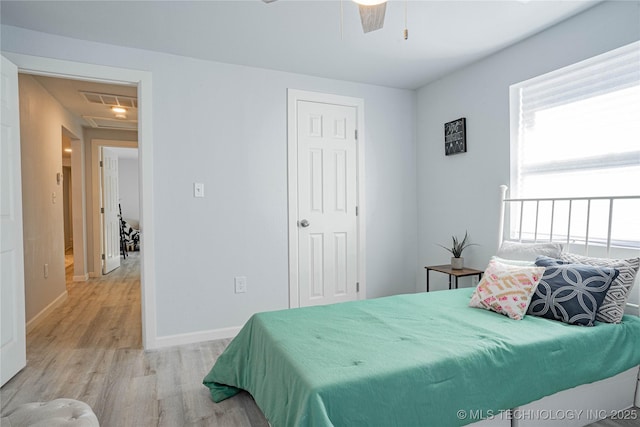 2017 N Quaker Ave, Tulsa, OK 74106 - bedroom with light wood-style floors, baseboards, a closet, and ceiling fan