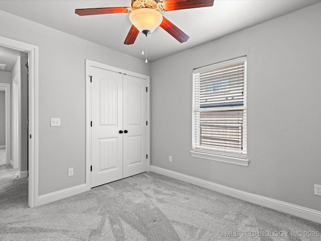 1912 Lester Ave, Bartlesville, OK 74006 - unfurnished bedroom with carpet flooring, baseboards, a closet, and ceiling fan