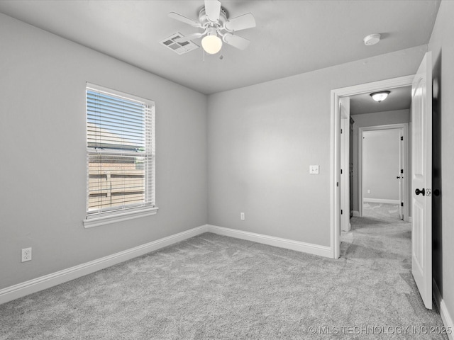 1912 Lester Ave, Bartlesville, OK 74006 - empty room with ceiling fan, carpet floors, a smoke detector, and baseboards