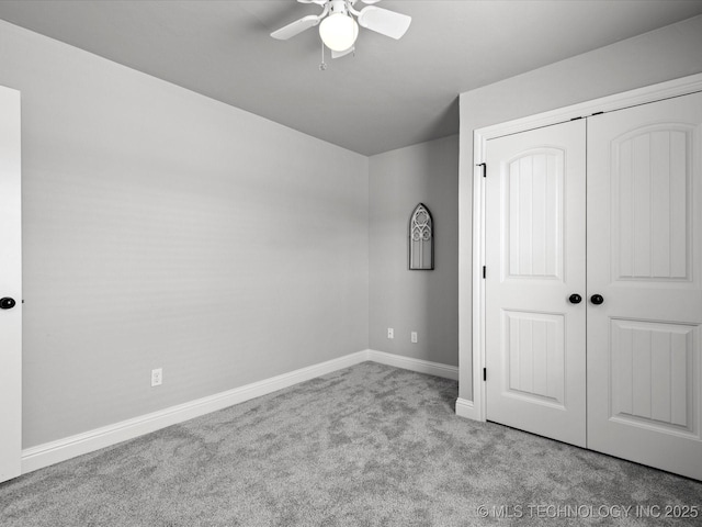 1912 Lester Ave, Bartlesville, OK 74006 - unfurnished bedroom featuring carpet, baseboards, a closet, and a ceiling fan