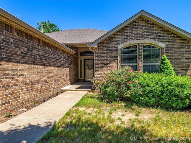 1912 Lester Ave, Bartlesville, OK 74006 - view of exterior entry featuring brick siding