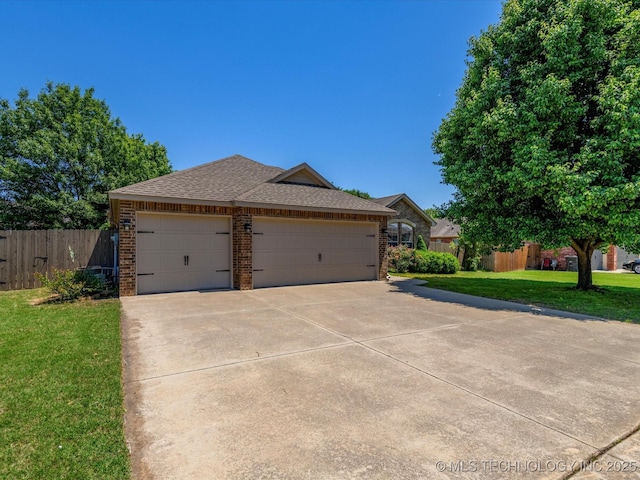 1912 Lester Ave, Bartlesville, OK 74006 - single story home featuring brick siding, concrete driveway, an attached garage, and roof with shingles