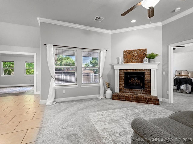 1912 Lester Ave, Bartlesville, OK 74006 - tiled living room with ornamental molding, a ceiling fan, baseboards, a fireplace, and carpet flooring