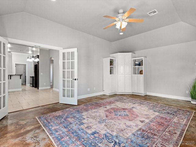 1912 Lester Ave, Bartlesville, OK 74006 - empty room featuring french doors, vaulted ceiling, a ceiling fan, a chandelier, and baseboards