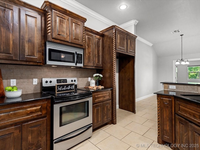 1912 Lester Ave, Bartlesville, OK 74006 - kitchen featuring appliances with stainless steel finishes, dark countertops, decorative backsplash, light tile patterned flooring, and vaulted ceiling