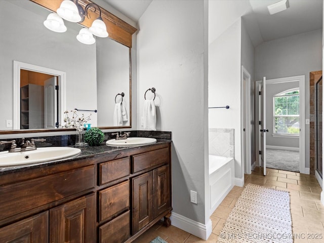 1912 Lester Ave, Bartlesville, OK 74006 - bathroom with double vanity, a bath, a stall shower, and tile patterned floors
