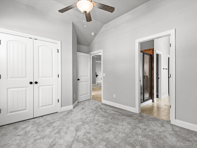 1912 Lester Ave, Bartlesville, OK 74006 - unfurnished bedroom with carpet, vaulted ceiling, a closet, baseboards, and a ceiling fan
