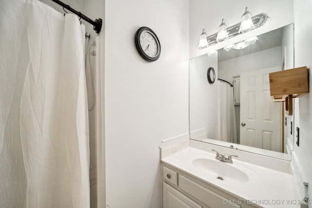 full bath with vanity and curtained shower