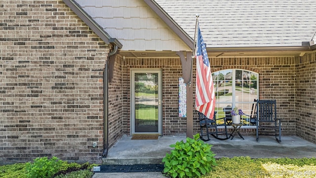property entrance with brick siding