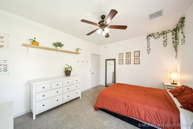 bedroom with light carpet, baseboards, and ceiling fan