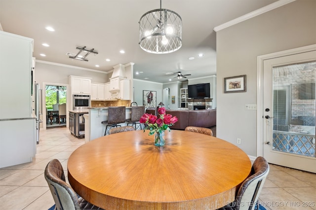 dining space with light tile patterned floors, recessed lighting, crown molding, wine cooler, and a chandelier