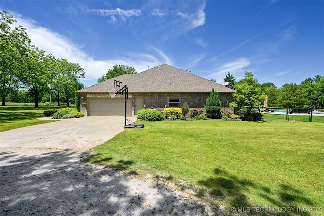ranch-style home with a garage, concrete driveway, a front yard, brick siding, and a shingled roof
