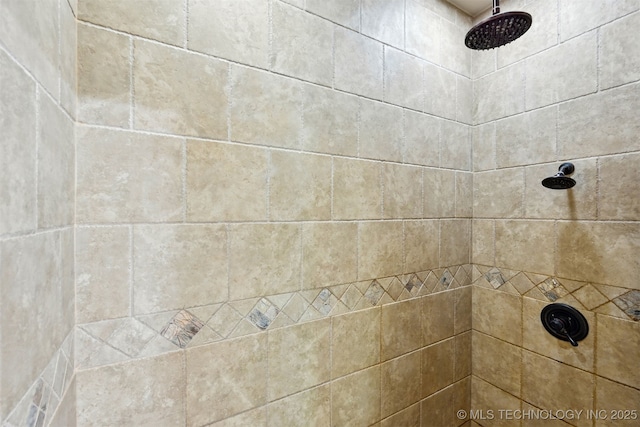 full bathroom with tiled shower