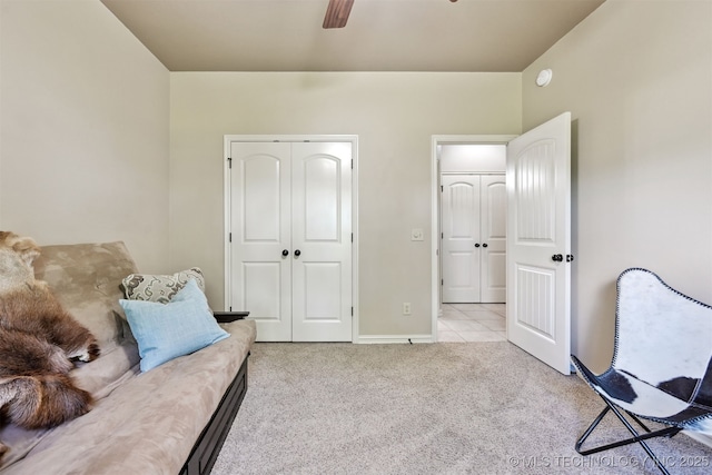 sitting room with carpet flooring, a ceiling fan, and baseboards