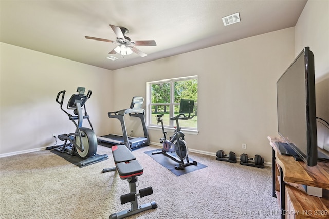 exercise room with carpet, a ceiling fan, and baseboards