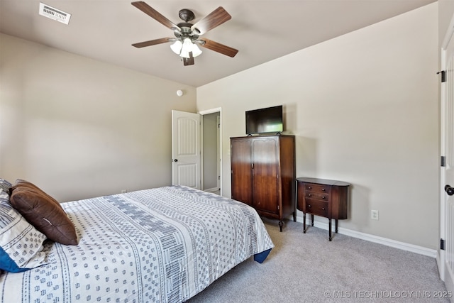 bedroom with light colored carpet, baseboards, and a ceiling fan