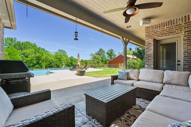 view of patio featuring an outdoor hangout area, area for grilling, an outdoor pool, fence, and ceiling fan