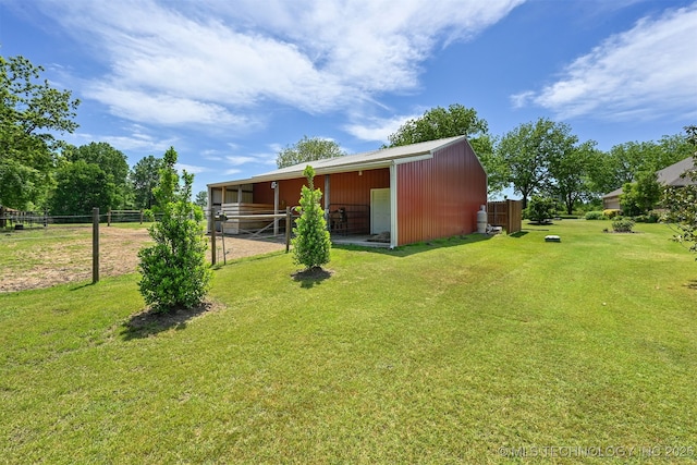 back of property featuring an outbuilding and an exterior structure