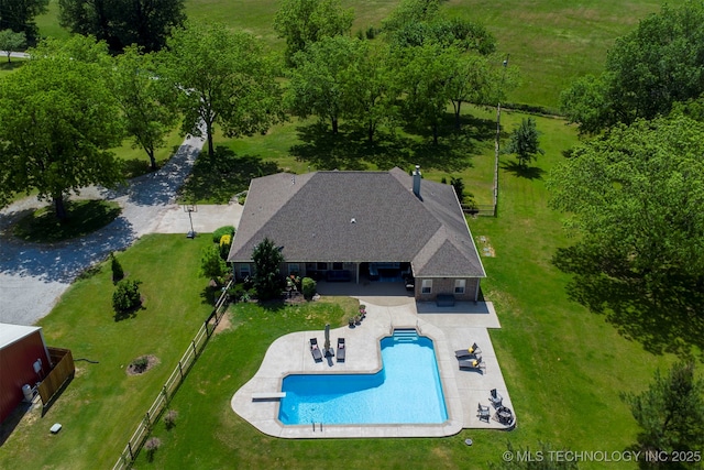 view of subject property with a pool area