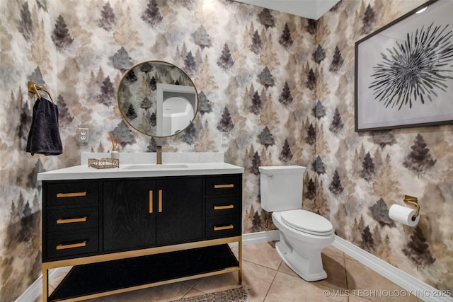 4501 E 108th Pl, Tulsa, OK 74137 - bathroom with wallpapered walls, baseboards, toilet, tile patterned floors, and vanity