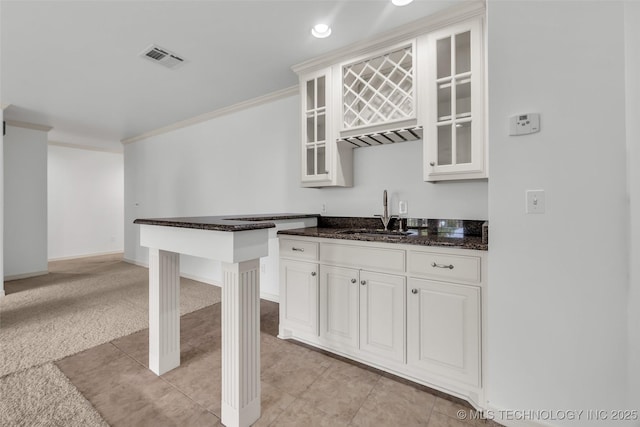 4501 E 108th Pl, Tulsa, OK 74137 - indoor wet bar featuring light carpet, ornamental molding, light tile patterned floors, baseboards, and recessed lighting