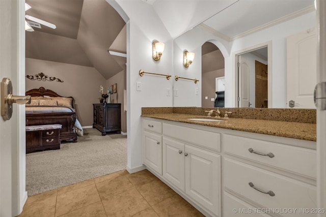4501 E 108th Pl, Tulsa, OK 74137 - ensuite bathroom with tile patterned floors, vanity, vaulted ceiling, ornamental molding, and baseboards