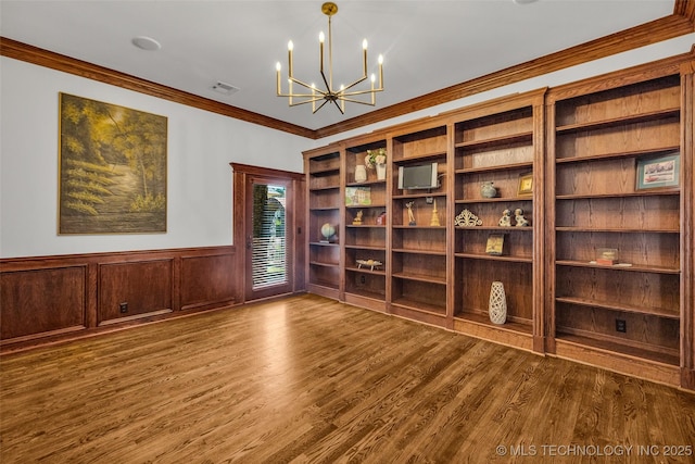 4501 E 108th Pl, Tulsa, OK 74137 - empty room featuring a chandelier, crown molding, wainscoting, and wood finished floors