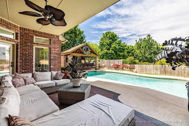 4501 E 108th Pl, Tulsa, OK 74137 - view of pool with outdoor lounge area, a gazebo, a patio, ceiling fan, and a fenced backyard