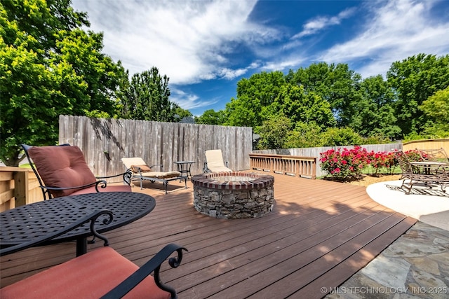 4501 E 108th Pl, Tulsa, OK 74137 - wooden deck with an outdoor fire pit, fence, and outdoor dining space