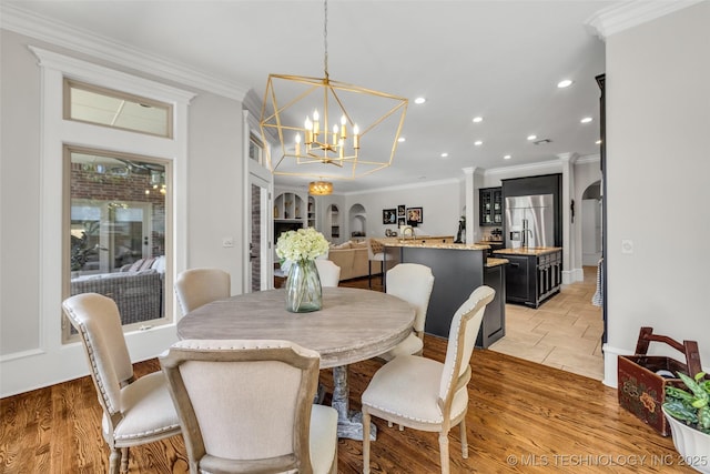 4501 E 108th Pl, Tulsa, OK 74137 - dining space with ornamental molding, a chandelier, recessed lighting, and arched walkways