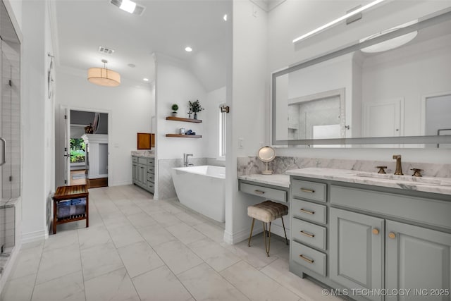 4501 E 108th Pl, Tulsa, OK 74137 - full bathroom with a stall shower, vanity, a freestanding tub, recessed lighting, and marble look tiles
