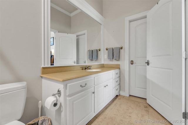 4501 E 108th Pl, Tulsa, OK 74137 - bathroom with crown molding, toilet, vanity, and tile patterned flooring