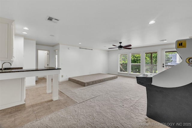 4501 E 108th Pl, Tulsa, OK 74137 - unfurnished living room featuring a ceiling fan, light colored carpet, recessed lighting, light tile patterned flooring, and a sink