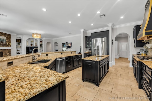 4501 E 108th Pl, Tulsa, OK 74137 - kitchen with stainless steel appliances, dark cabinets, a sink, a large island, and crown molding