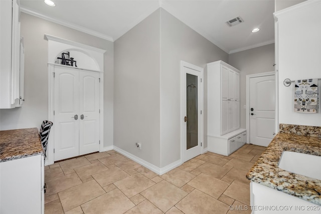 4501 E 108th Pl, Tulsa, OK 74137 - foyer entrance with crown molding, recessed lighting, baseboards, and light stone finish flooring