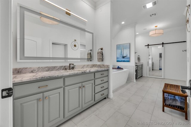 4501 E 108th Pl, Tulsa, OK 74137 - bathroom featuring vanity, a freestanding tub, recessed lighting, and marble finish flooring
