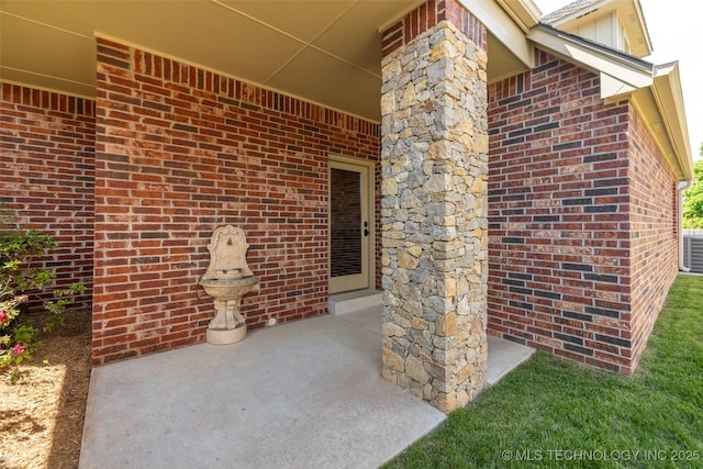 4501 E 108th Pl, Tulsa, OK 74137 - property entrance with brick siding and central air condition unit