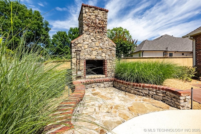 4501 E 108th Pl, Tulsa, OK 74137 - view of patio with an outdoor fireplace and fence