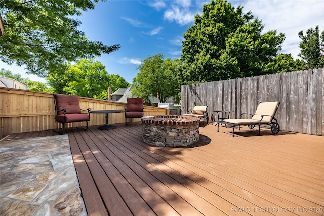 4501 E 108th Pl, Tulsa, OK 74137 - wooden terrace with a fire pit and fence
